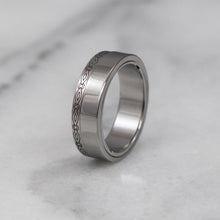 Load image into Gallery viewer, Engraved sculpted steel gamos interlocking engagement and wedding ring